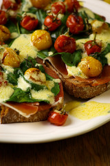 Crostini with prosciutto, swiss chard, cherry tomato vinaigrette