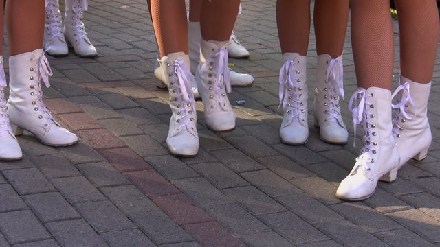 White boots on nice legs of cheerleaders
