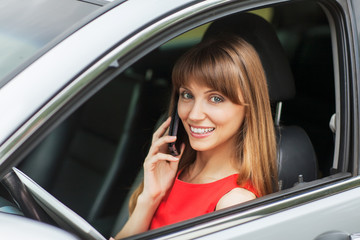 Fototapeta na wymiar Businesswoman in the car on the phone.