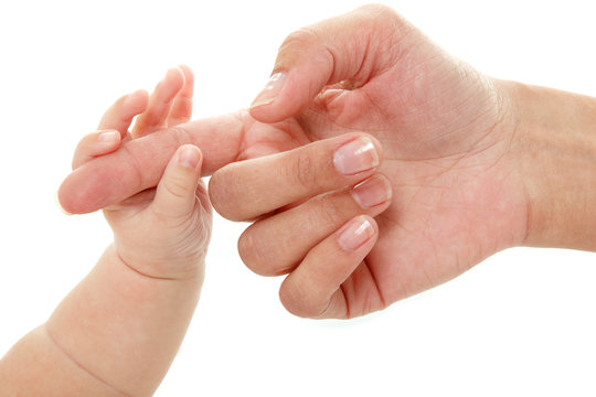baby holds mother's finger hand, trust family help concept, isol