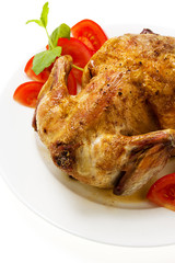 fried chicken with vegetables on the ceramic plate