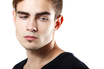 Fototapeta premium Handsome young man touching his hair, portrait of sexy guy looki