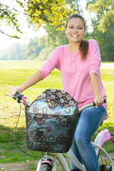 Happy student girl with bicycle