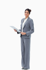 Smiling saleswoman with clipboard