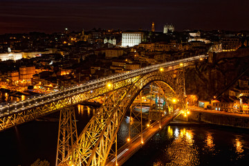 Fototapeta na wymiar Bridge of Luis I at night over Douro river and Porto, Portugal