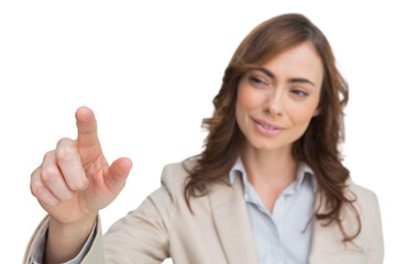 Businesswoman touching invisible screen