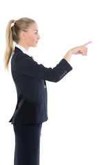 Profile view of attractive blonde businesswoman pointing