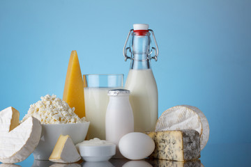 Dairy products on blue background with copy-space