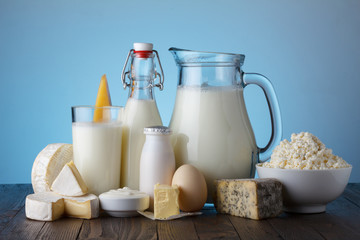 Dairy products on wooden table still life