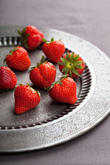 strawberry on vintage plate