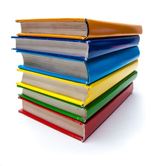 Colorful real books on white background