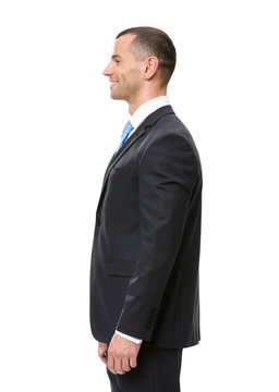 Profile of business man wearing black suit and blue tie