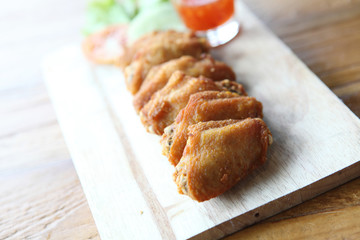 Fried chicken on wood background
