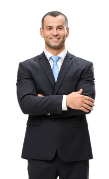 Half-length portrait of business man with hands crossed