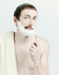 young man shaving