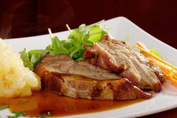 Fried pork chop, mashed potato and vegetable salad