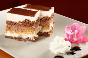 chocolate cream cake on white plate