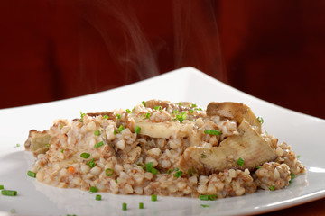 Buckwheat porridge with mushrooms and onions on the dining table