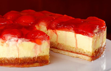 A wedge of vanilla cake with strawberries