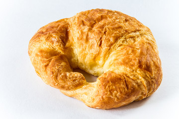 Fresh and tasty croissant over white background