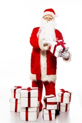 Santa Claus with gift boxes isolated on white background