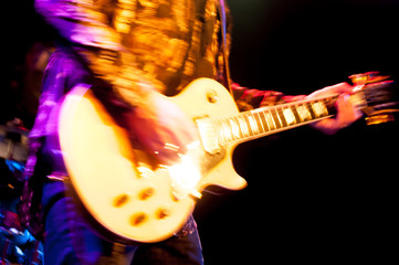 motion blur glam rock guitarist