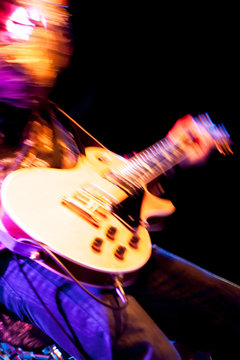 motion blur rock guitarist
