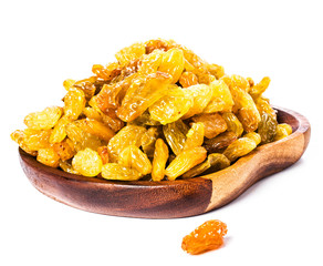 Yellow  Shiny Raisins isolated on white background in a  wooden