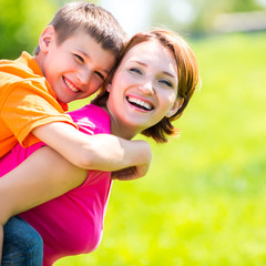 Happy mother and son outdoor portrait