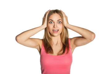 Fototapeta premium A young girl clutching her head, surprise