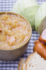 Bigos, sauerkraut and sausage stew with ingredients.