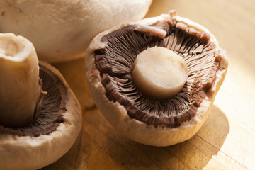 Peeled mushrooms on chopping board