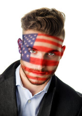 Young man, face painted with Stars and Stripes, American flag