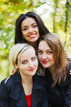 Portrait of Three Girlfriends in Park