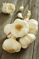 Garlic heads on a wooden table