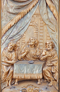 Leuven - relief of scene Jesus with the apostle in Emauzy