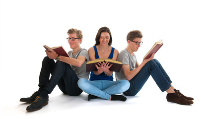 Fototapeta premium Adult male twins and young girl reading books
