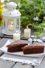 Fototapeta na wymiar Danish traditional christmas. Chocolate cake and white handmade