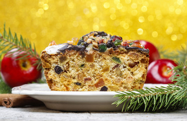 Fruitcake with dried fruits and nuts in christmas setting