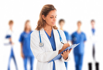 Doctor writing on a clipboard