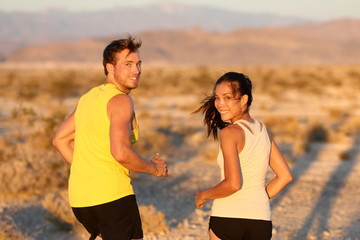Exercise - couple running looking happy