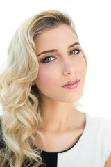Naklejka premium Slightly content smiling blonde model looking at camera