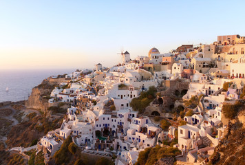 Sunset view of Oia village on Santorini island, Greece.