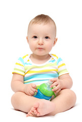 Fototapeta na wymiar baby boy holding milk bottle