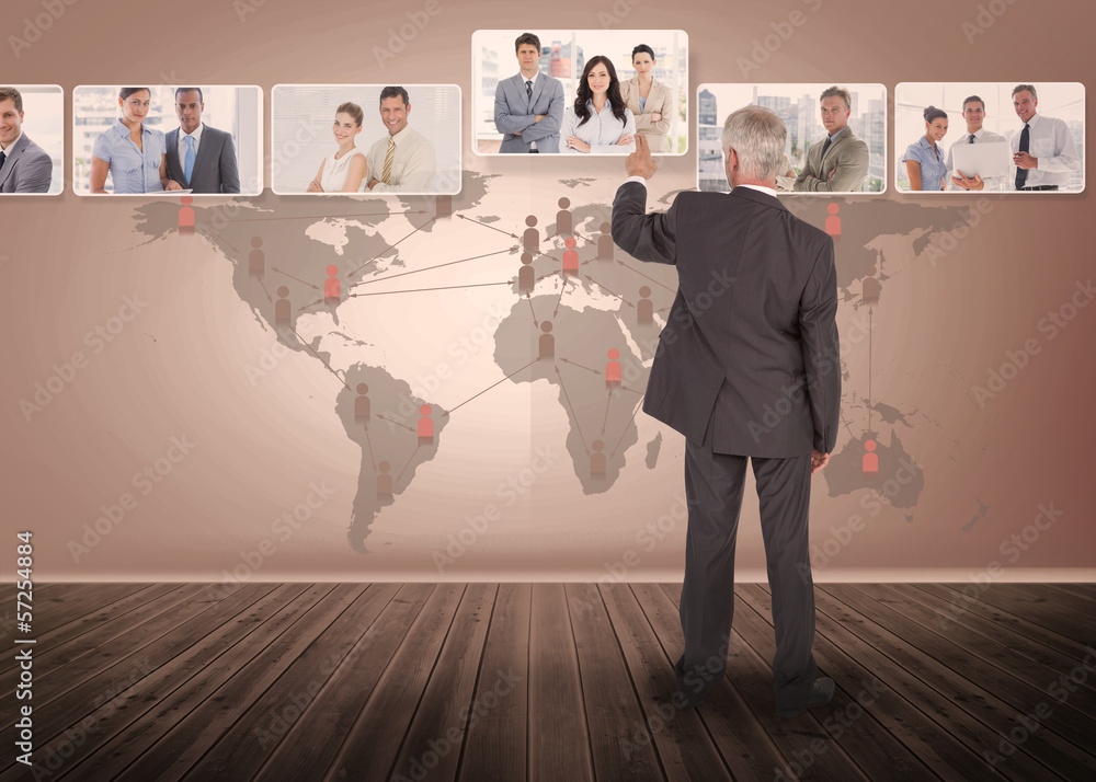 Poster Businessman selecting digital interface with map on background