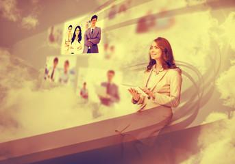 Pretty businesswoman using digital interface
