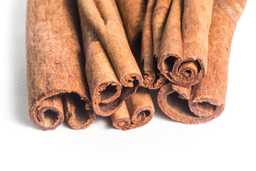 Cinnamon sticks on white background