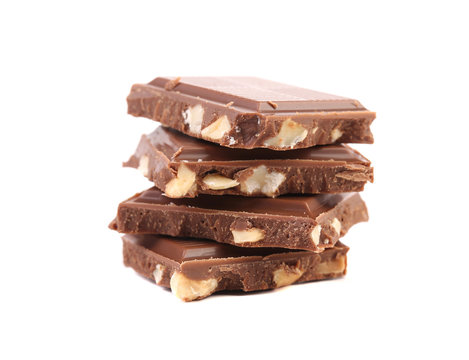 Stack of chocolate bars with nuts.