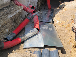 electrical cables and optical fibres in the excavation