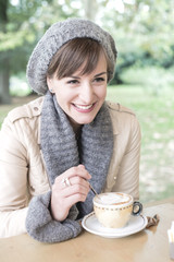 young beautiful woman sitting at the bar